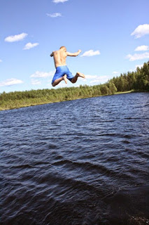 person jumping into water