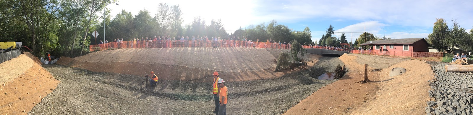 People watching the restoration of Padden Creek