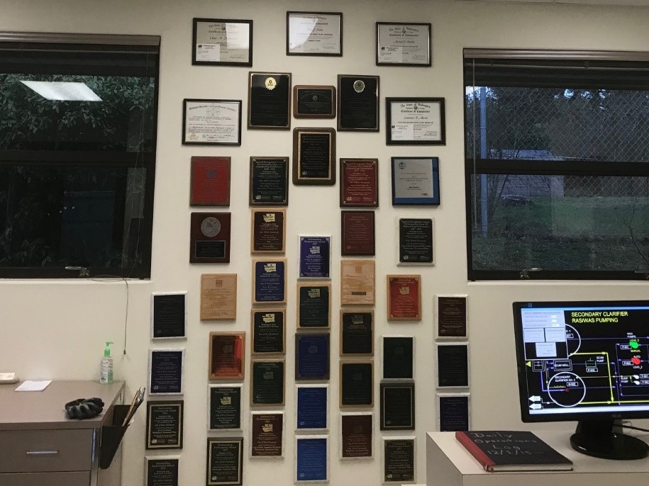 Wall full of awards won by the Port Townsend wastewater treatment plant