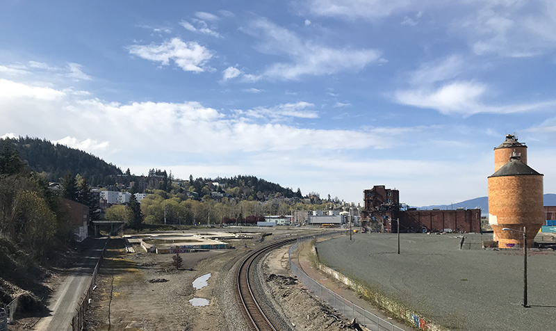 The new site is currently a cement pad between downtown, and Western Washington University, inland of the train tracks.
