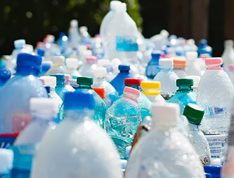 Recycled plastic bottles leach more chemicals into drinks, review