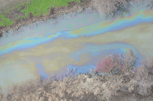 Rainbow sheen from used motor oil that spilled into Sulphur Creek near Sunnyside in March 2015.