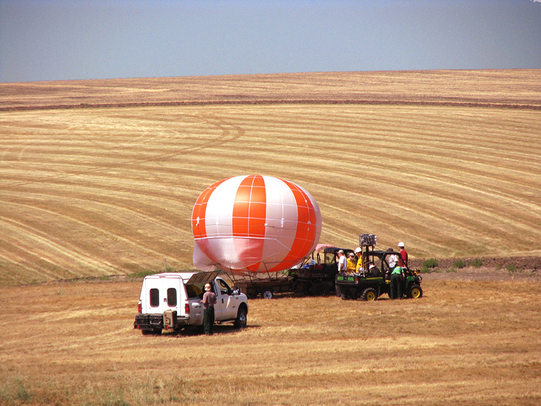 Air balloon being launched with research equipment attached.