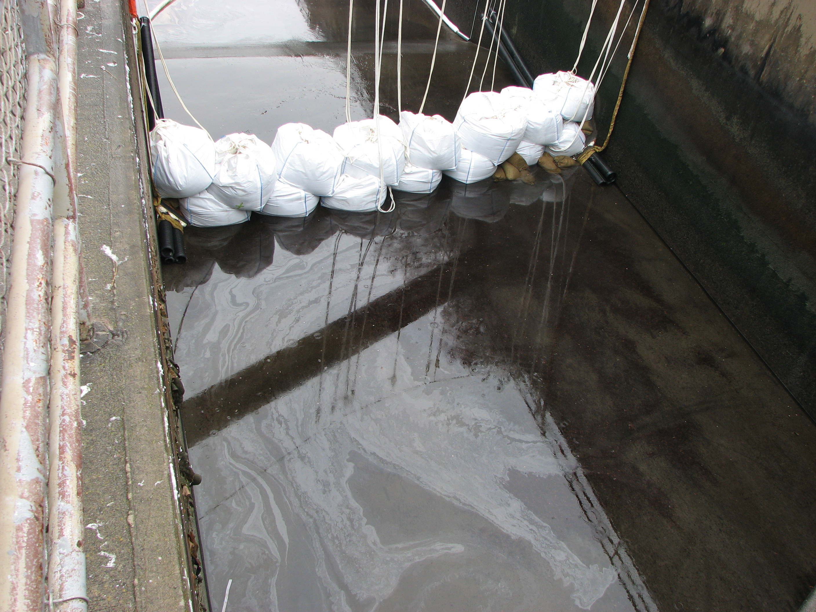 Sorbents in the sluiceway collecting oil.  