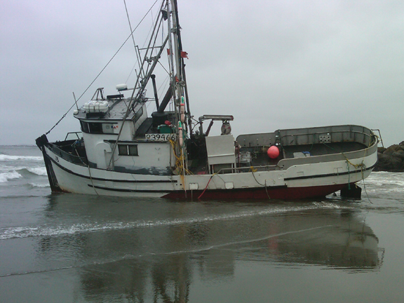 Fishing vessel JB run aground on beach.