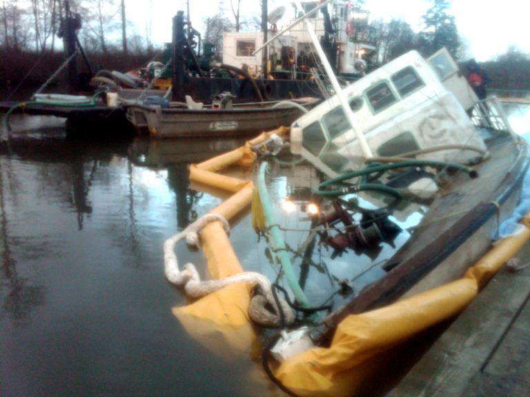 Gypsy Queen sunk near a dock.