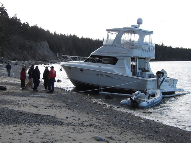 Vessel grounded after hitting nearby reef. 