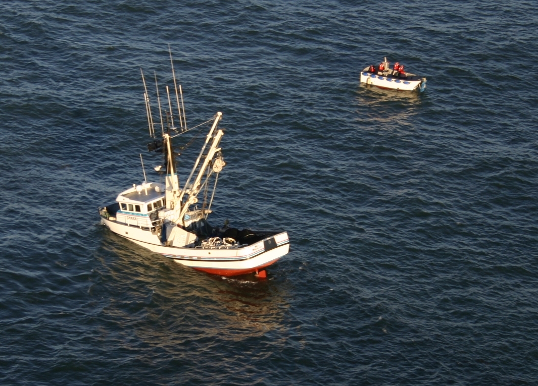The fishing vessel, F/V Miss Michelle (left) with submerged bow