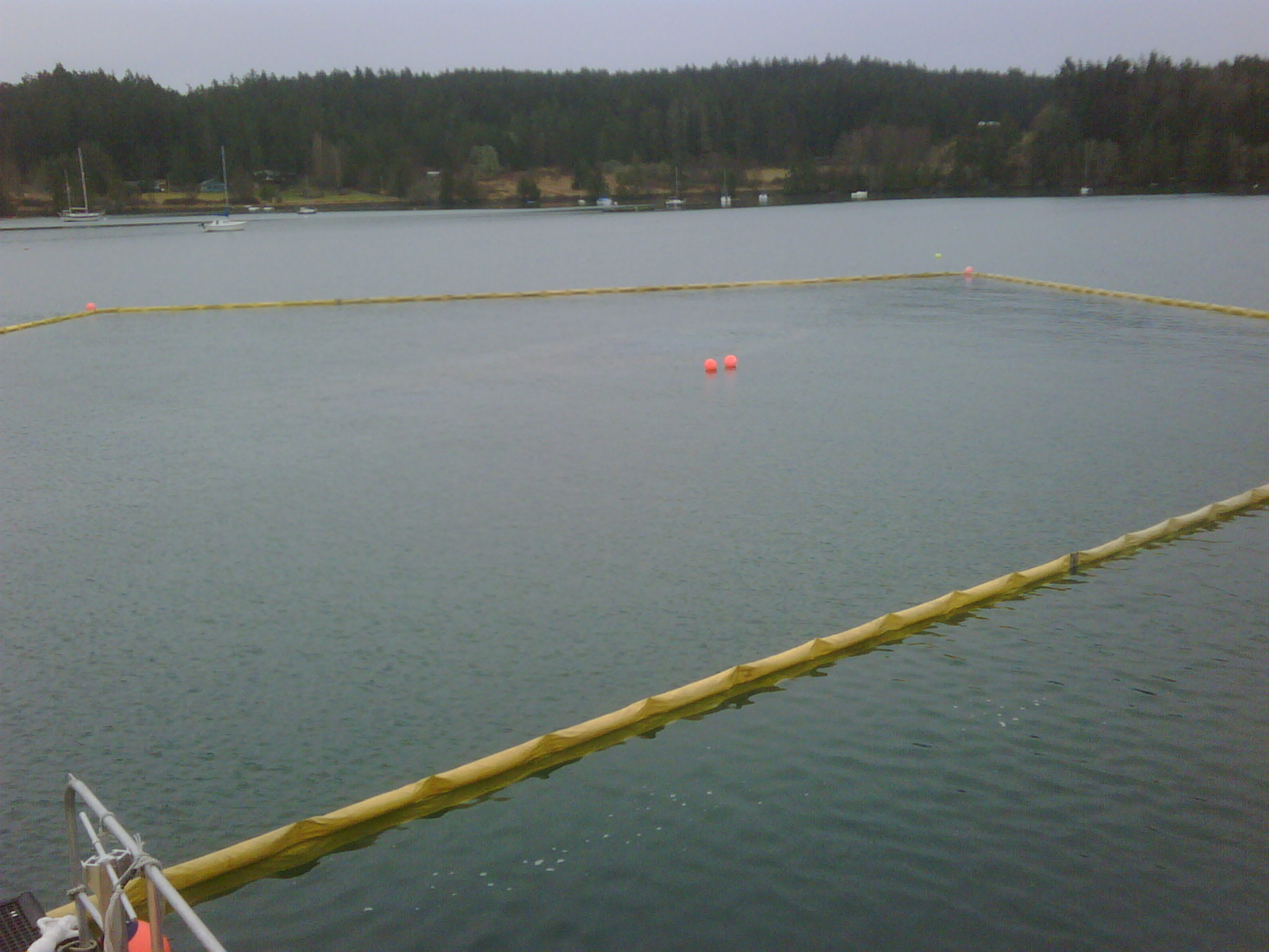 Slight sheen by buoys coming off vessel. 