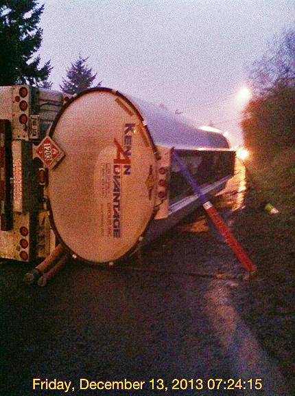 Tanker truck on its side.