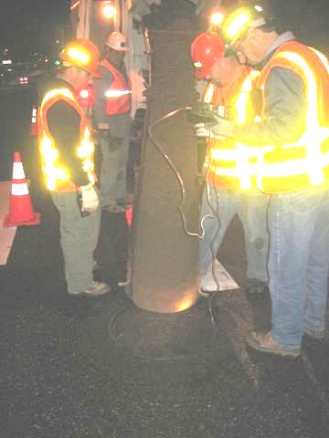 Public Works employees sealing the inactive Sunset Drive sewer line