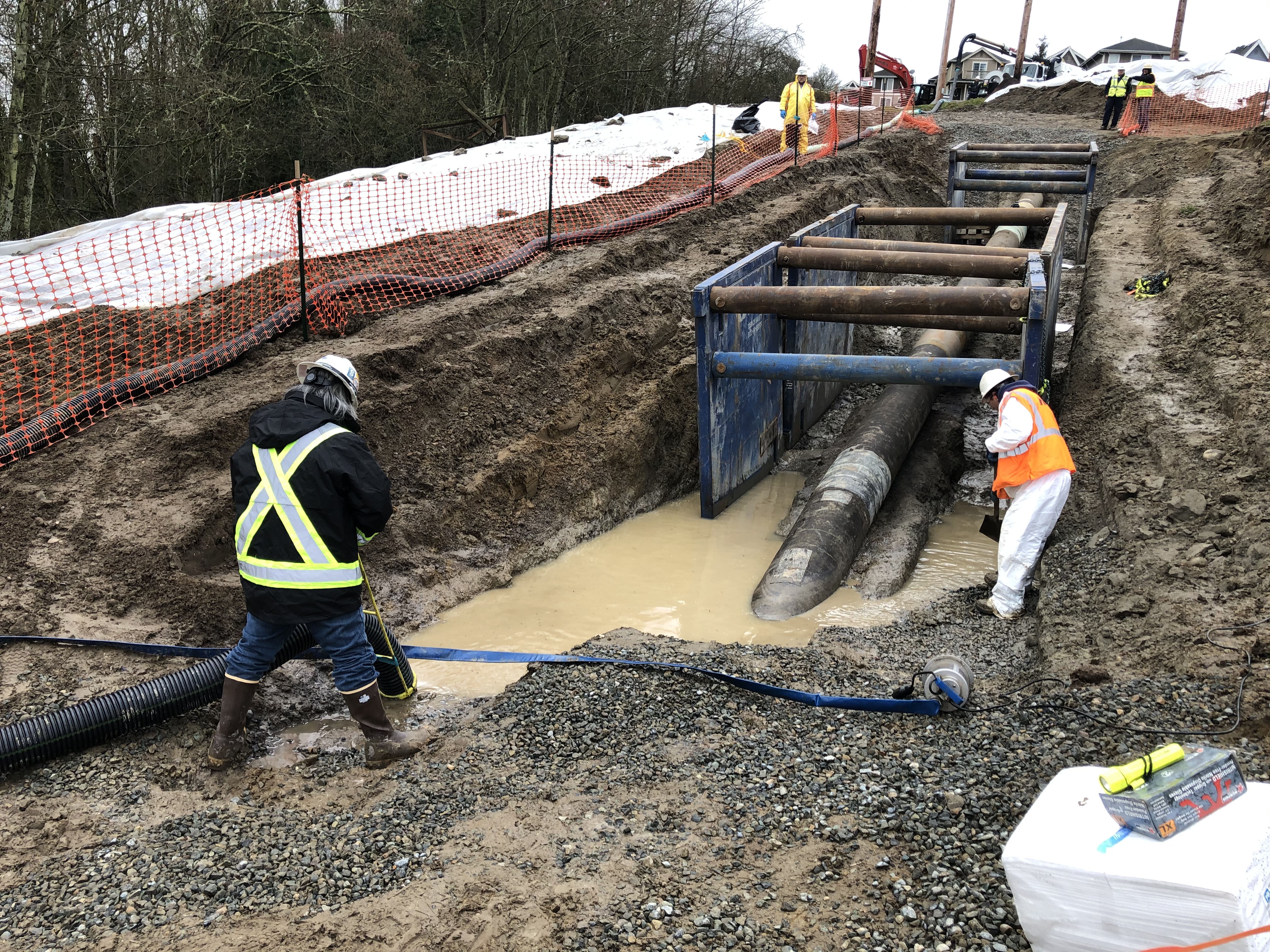 Responders working in a trench