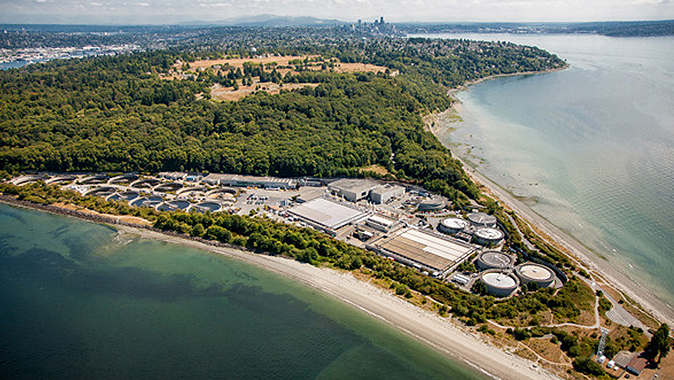 Aerial view of the treatment plant, situated on a point of land surrounded by Puget Sound