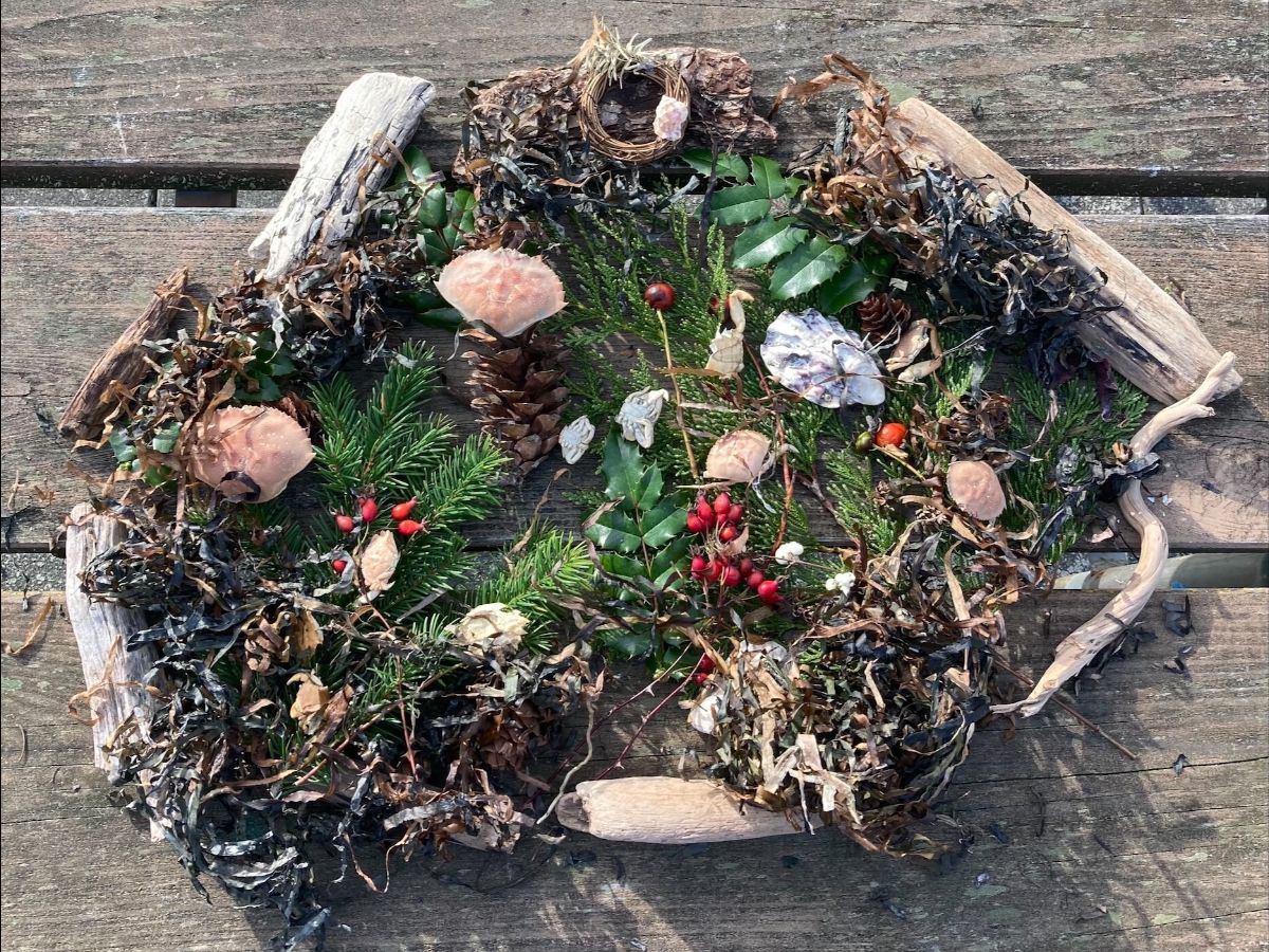 wreath made of driftwood, dried eel grass, holly and shells