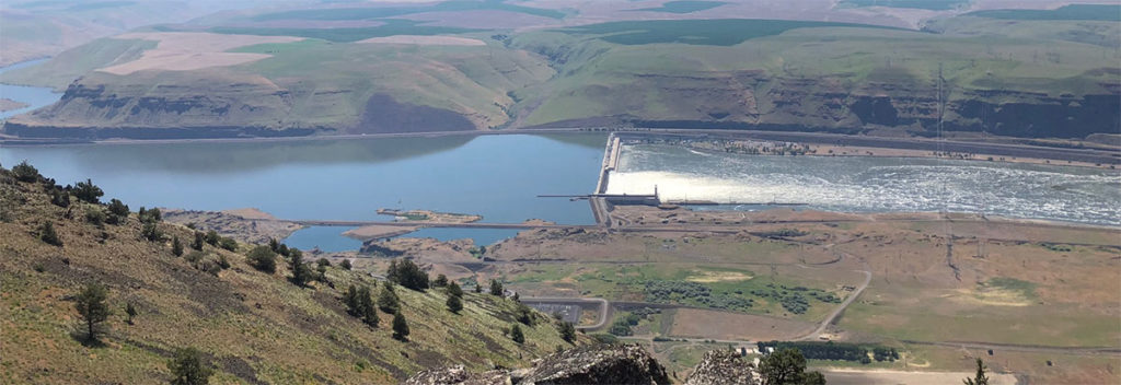 John Day Dam and the Columbia River on a sunny day looking down from the proposed location of the upper reservior.