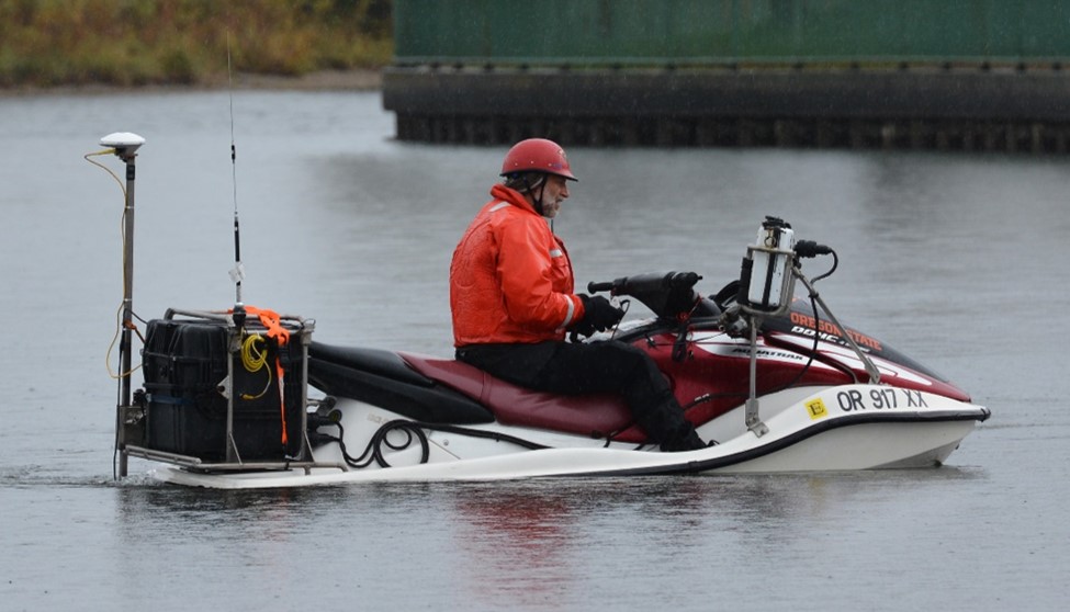 CMAP surveyor collecting data on a personal watercraft mounted with a GPS antenna and single beam sonar. 