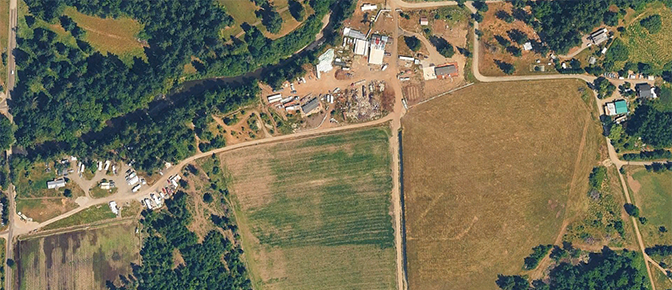 Aerial image shoreline property with development along the river