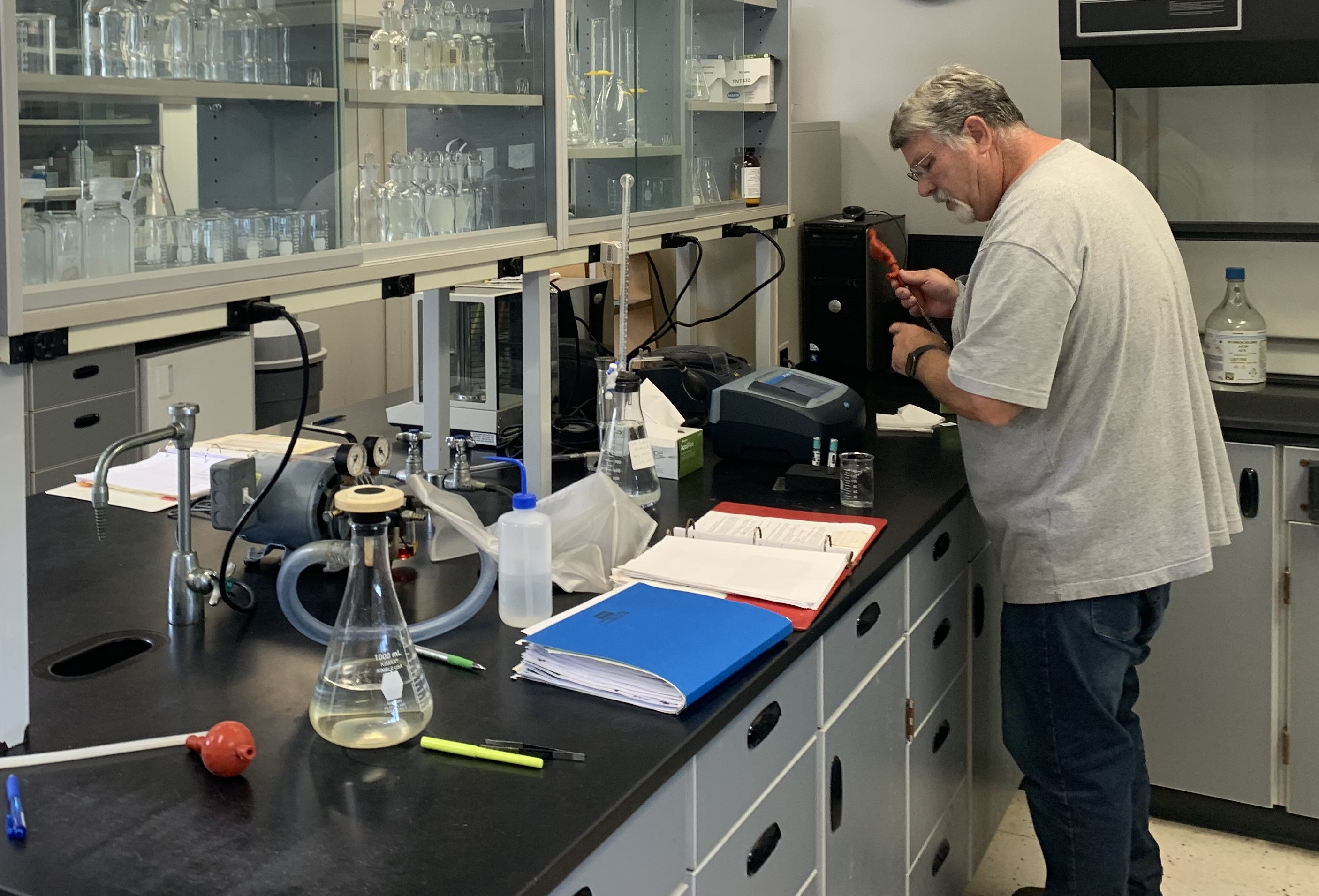 Wastewater treatment operators do many jobs in a day, including testing samples in a lab