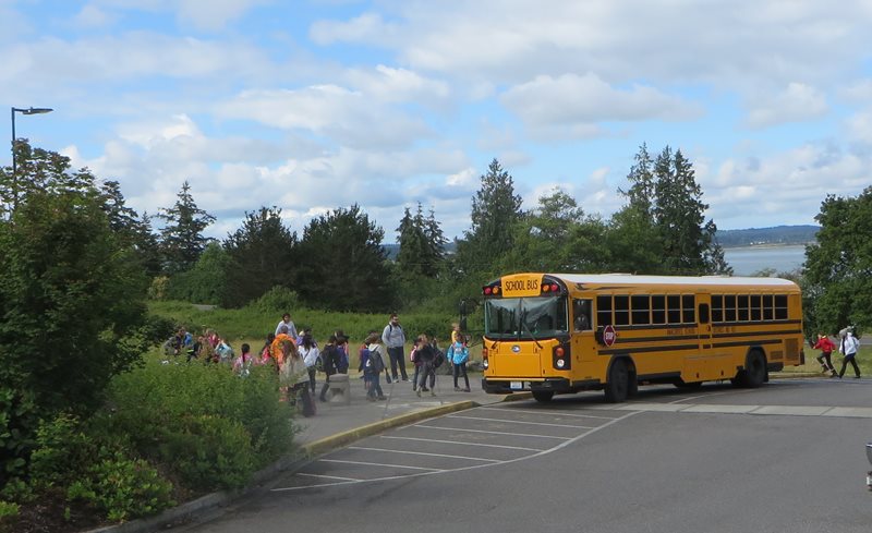 A schoolbus unloading children for a visit at Padilla Bay.