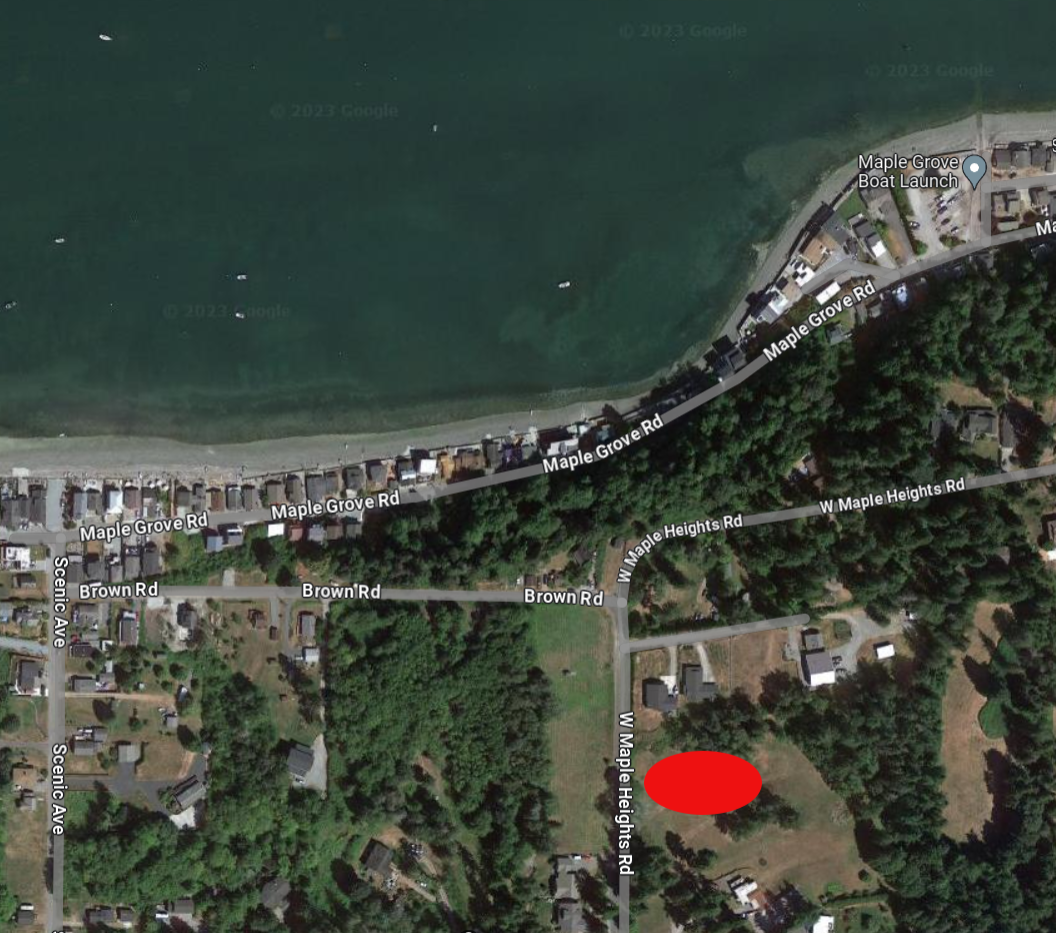 An aerial view of the Maple Grove Community on Camano Island. A large red oval indicates where the community septic system is located.