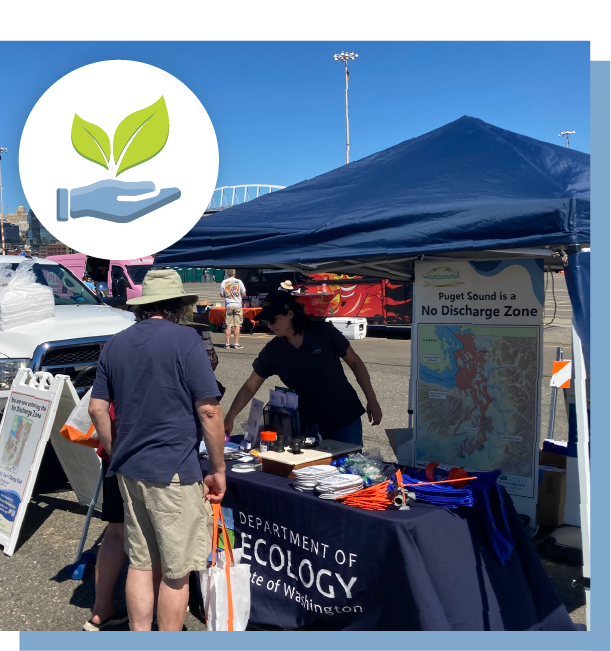 Ecology staff speaking with the public at a community event