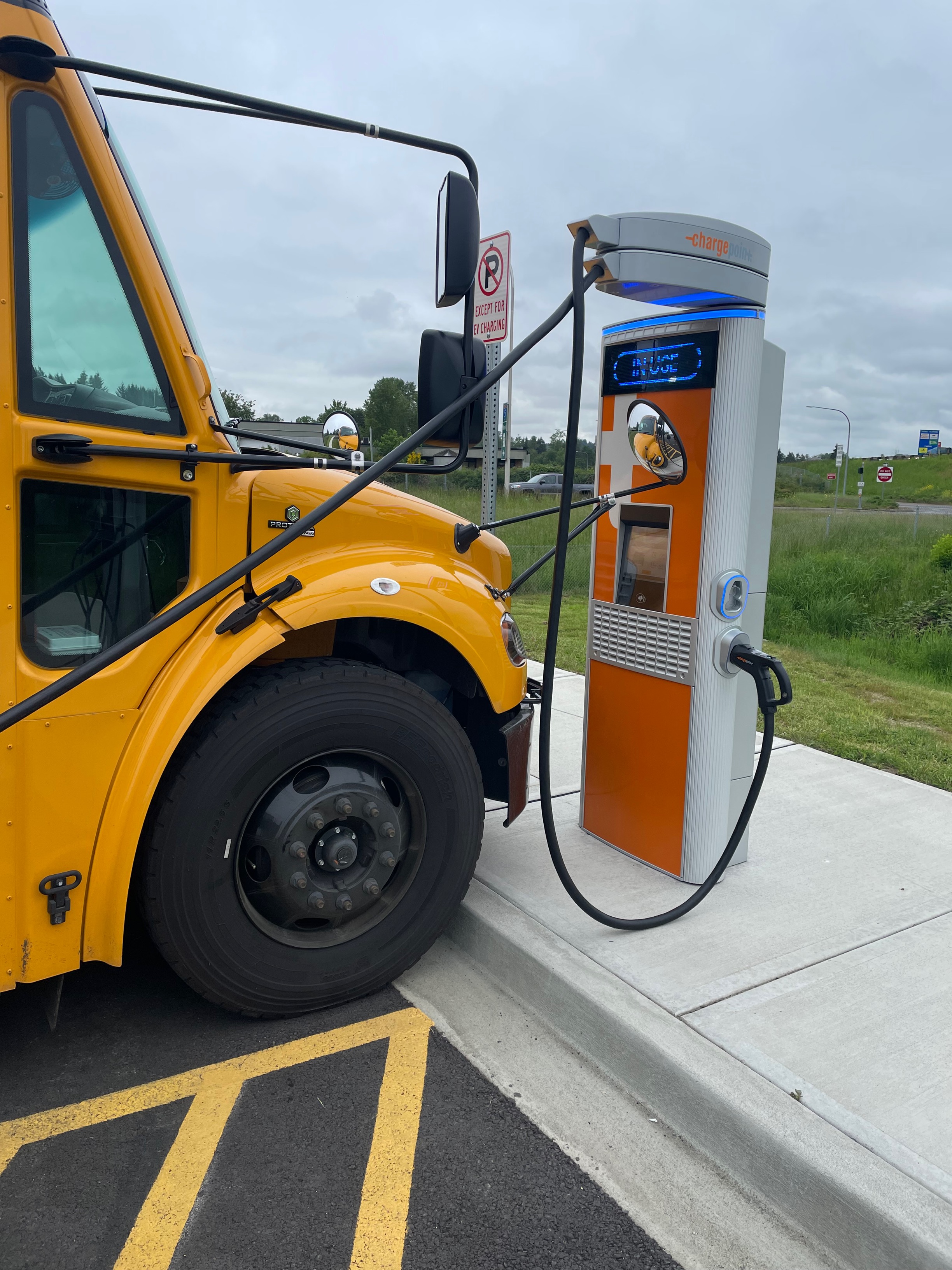 An electric bus at a charging station.