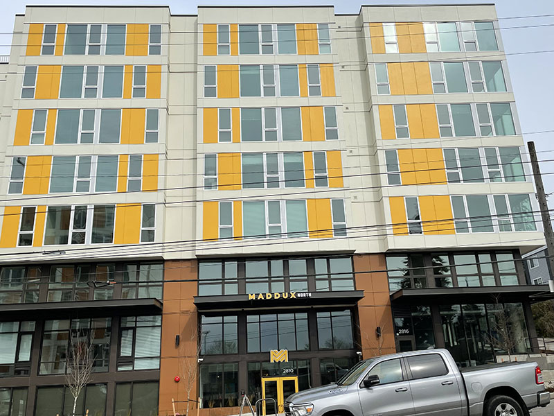 The Maddux building - a multi-story building with yellow accents