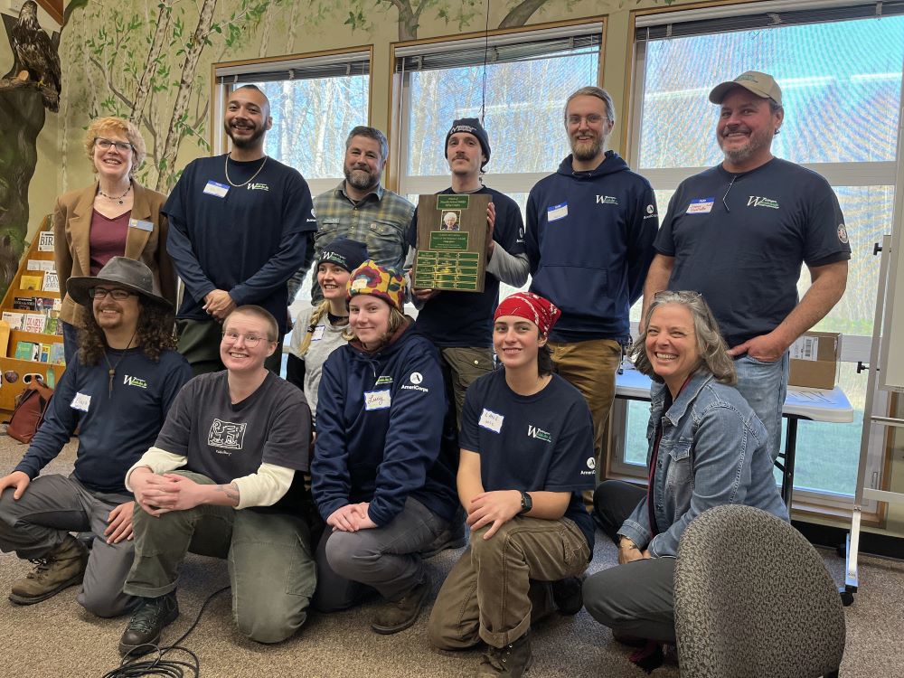 WCC members and staff pose with representatives of Friends of Nisqually National Wildlife Refuge as they accept the 2024 Clarice McCartan award.